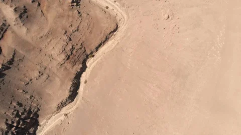 Aerial view of dry river between sand desert rock mountains Atacama Chile. Drone Stock Footage 93829148