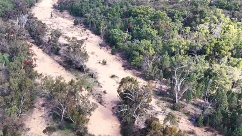 Aerial View of a Dry Sandy Creek Bed in the Outback Stock Footage 345457261