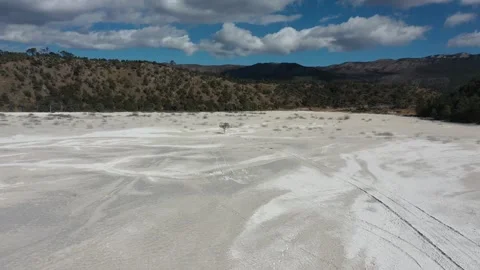 Aerial view of dry white riverbed with dead tree and mountains in Lijiang Yunnan Video stock 345066956