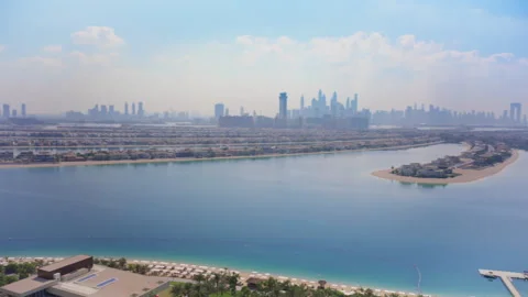 Aerial View of Dubai Skyline and Palm Jumeirah Island with Luxury Villas. Stock Footage 337904409