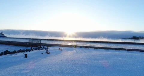 Aerial View of Duluth Pier and Frozen Lake Superior Stock Footage 99963902