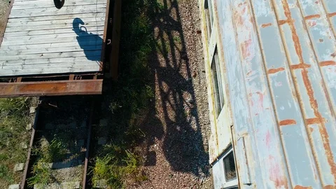 Aerial view of a dump of abandoned rusty trains and crane in  near Chernobyl Stock Footage 124323872
