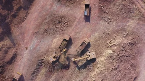 Aerial View of Dump Trucks Loading at Mountain Quarry Site Stock Footage 319613955