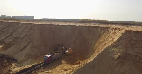 Aerial view of dump trucks with sand standing on territory industrial factory Stock Footage 82246866