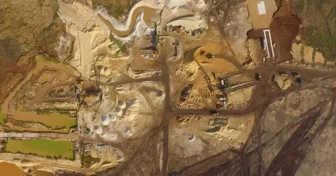 Aerial view of dump trucks with sand standing on territory industrial factory Stock Footage 82247292