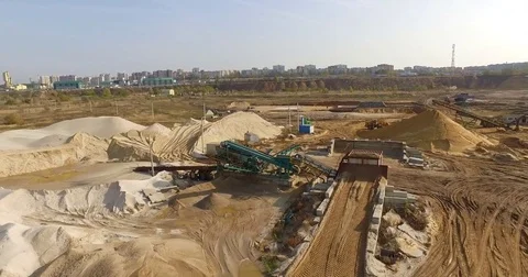 Aerial view of dump trucks with sand standing on territory industrial factory Stock-Footage 82247438