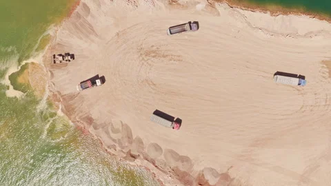 Aerial view of dump trucks working in a sand quarry Stock-Footage 345007195