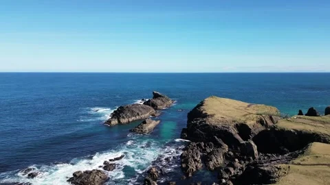 Aerial view of Dun Eistean on the rocky coast of Isle of Lewis, Scotland Stock Footage 254287300