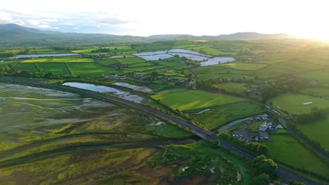 Aerial view of Dundrum bay during low tide, fields and rolling hills, North.. Stock Footage 337392959