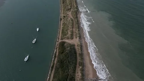 Aerial view dunes separate the river from the North Sea. Cabourg city. Tilt 4K Stock Footage 258337458