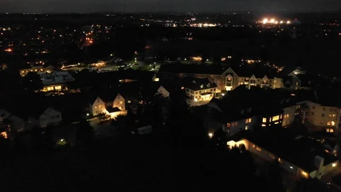 Aerial view during the night of a neighborhood in USA, light glowing from Stock Footage