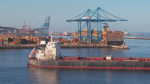 Aerial view during sunset over oil and transport ship and seeing loading and Stock Footage 302429982