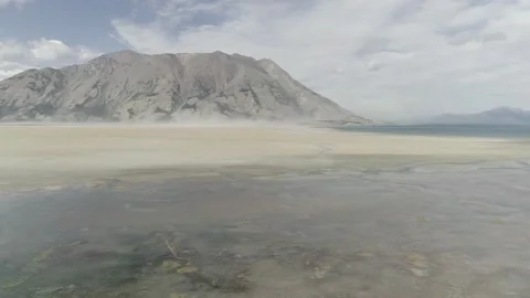 Aerial view of dust storm at Kluane Lake on the Alaska Highway. Stock Footage 153376508