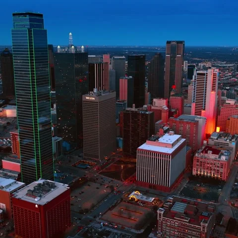 Aerial view of a dynamic cityscape at dusk, featuring a stunning array of i.. Stock Footage 334835161