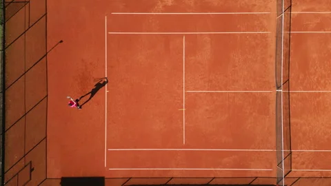 Aerial View of Dynamic Tennis Practice on Clay Court Stock-Footage 317954901