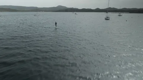 Aerial View of E-Foil Rider Flying Above the Sea Stock-Footage 344193314