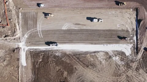 Aerial view of earthmoving bulldozer. A tracked bulldozer works in a sand quarry Stock Footage 256435327