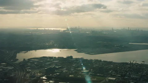 Aerial view of East River heading towards downtown Manhattan, New York City with Stock Footage 199459782