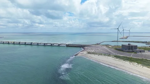 Aerial view of the Eastern Scheldt storm surge barrier with wind turbines Stockbeeldmateriaal 338127506