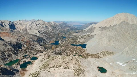 Aerial view of Eastern Sierra alpine lakes, mountain range valley in California Stock Footage 122839472