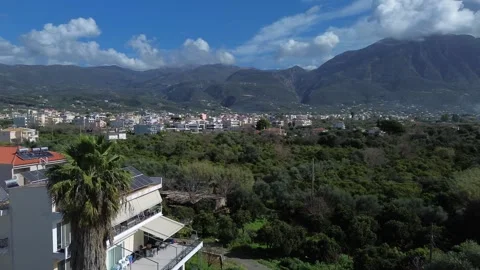 Aerial view of eastern suburbs of Kalamata city, green orchards in the Stock Footage 342303010