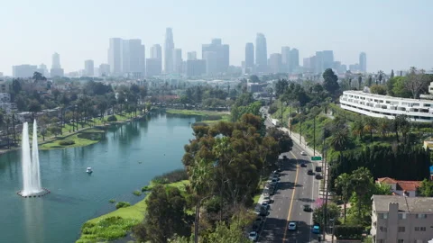 Aerial view of Echo Park Lake, car traffic, downtown Los Angeles city skyline Stock Footage 273835232