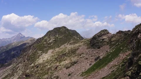 Aerial view of Edge of mountain view, with clouds, blue sky, desolate landscape Видео 171513551