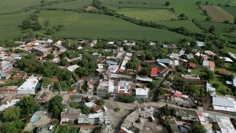 Aerial view of the edge of a small rural town in central Mexico Stock Footage 342089187