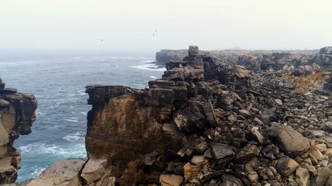 Aerial view edge steep cliff coast of Atlantic ocean in Portugal Video stock 108163388