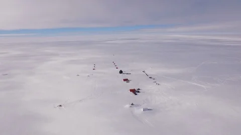 Aerial view of the EGRIP camp research station on a icy landscape in Greenland Stock Footage 104222842