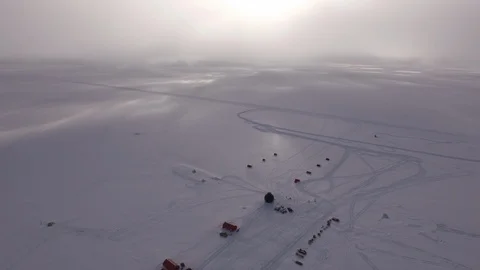Aerial view of the EGRIP camp research station on a icy landscape in Greenland Stock Footage 104223235