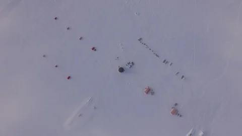 Aerial view of the EGRIP camp research station on a icy landscape in Greenland Stock Footage 104223660