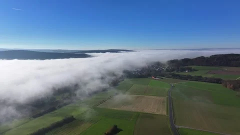 Aerial view of Eichenzell fields and fog, Germany. Stock Footage 317609788