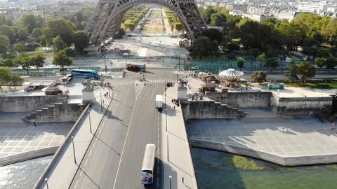 Aerial view of the Eiffel Tower with bridge in front, over the river in Paris Stock Footage 100591470