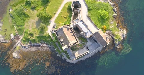 Aerial View of Eilean Donan Castle at Sunrise Stock Footage 98120619