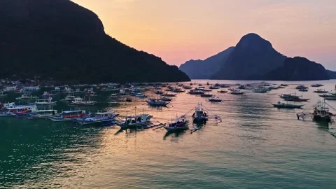 Aerial view of El Nido Beach with boats at sunset, Philippines. Stock Footage 344986837