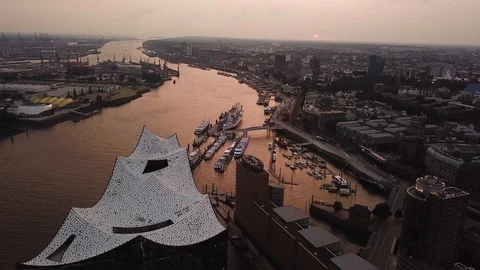 Aerial view of the Elbe River and the Opera House in Hamburg during sunset Stock Footage 122000215