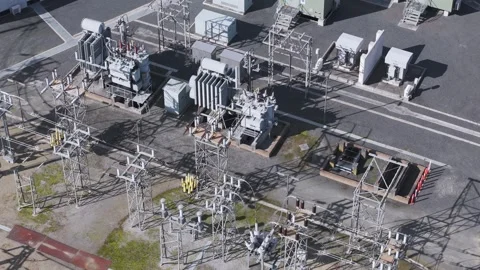 Aerial view of an electrical power substation with transformers Stock Footage 345531928