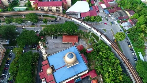 Aerial view. An elevated rail way built across township. 動画素材 83834766