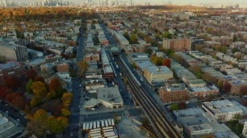 Aerial view of elevated train tracks through urban neighborhood, ProRes 422HQ Stock Footage 331356186