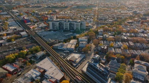 Aerial view of elevated train tracks and busy streets in Brooklyn, ProRes 422HQ Stock Footage 331358321