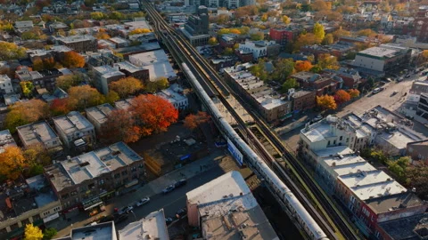 Aerial view of elevated train tracks over Brooklyn neighborhood, ProRes 422HQ Stock Footage 331360380