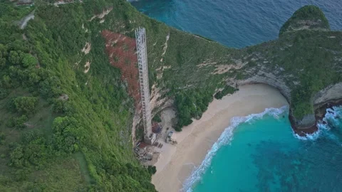 Aerial view of elevator construction on kelingking beach cliff Stock Footage 327817697