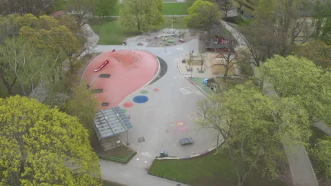 Aerial view of empty abandoned playground in a park during Covid-19 Coronavirus Stock Footage 131211052