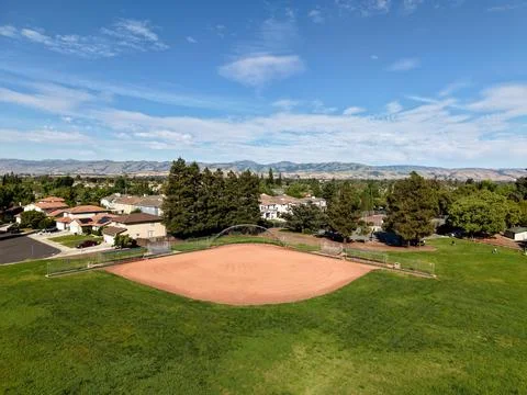Aerial View of Empty Baseball Field in Suburban Neighborhood with Mountains Stock Photos