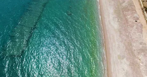 Aerial View Of Empty Beach and Rocky Sea Stock Footage 130613161