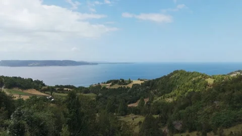 Aerial view of Empty bench overlooking Reloncavi Sound on Lemuy Island, Chile Stock Footage 302370169