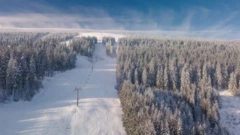 Aerial view of Empty cableway in alpine ski resort in beautiful sunny mountain Stock Footage 148209850