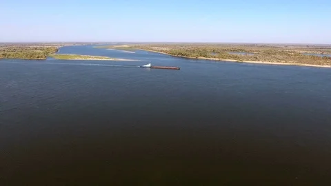Aerial view of an empty cargo barge floating along the longest river Volga. 4K Stock Footage 73635507