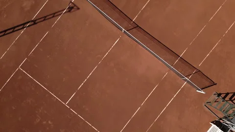 Aerial view of empty clay tennis court on a sunny day Stock Footage 260551239